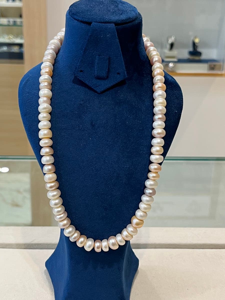 Collier de perles roses et blanches